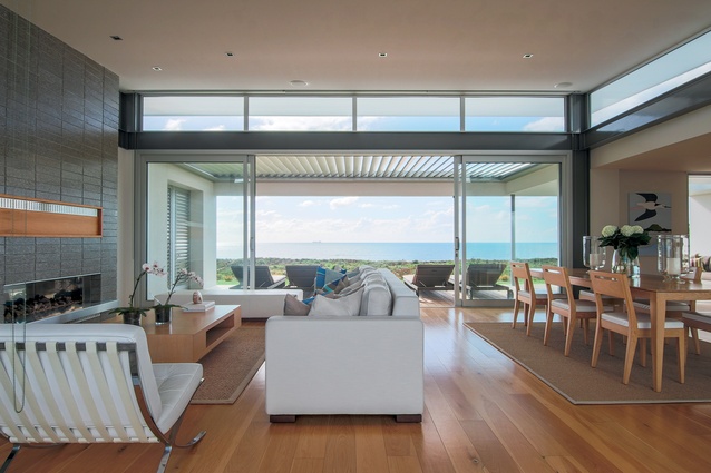 Clearstory windows allow light to spill over the covered terrace and into the living area. 
