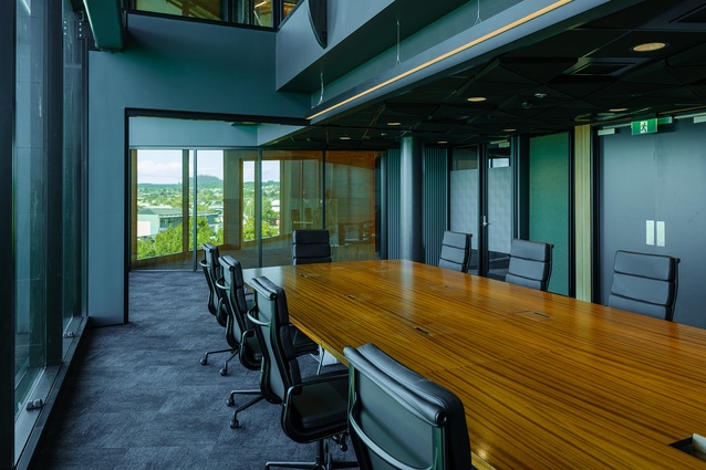Warm, textured wool flooring complements the timber and creates a calm meeting space.
