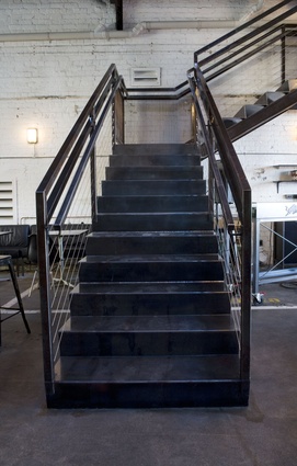 A significant insertion: a new steel stair to match the industrial aesthetic of the surrounds.