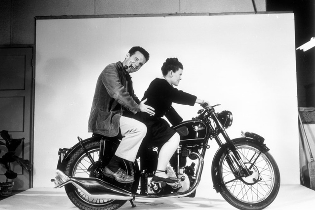 Charles and Ray Eames posing on a Velocette motorcycle, 1948, as seen in Jason Cohn and Billl Jersey's documentary Eames: the Architect and the Painter.