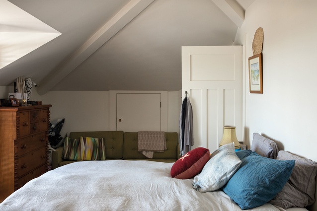 A large skylight in the bedroom introduces an abundance of natural light.