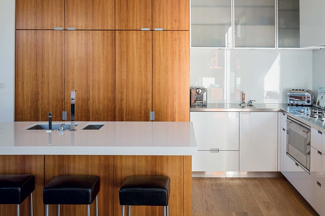 The kitchen is a muted mix of timber and white.