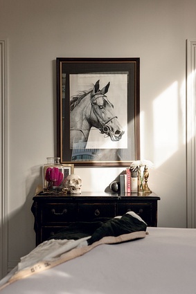 A vintage drawing takes pride of place in the master bedroom.