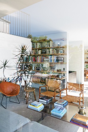 Secondary living areas feature designer furniture, as well as Moisés Micha's collection of books and personal effects.  