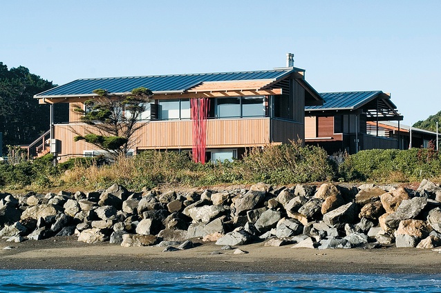 The timber-clad house, seen from the water.