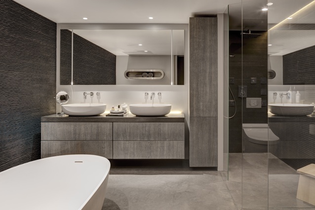 Within the cube, the bathroom is a serene space, its enclosure contrasting with the openness of the rest of the apartment.