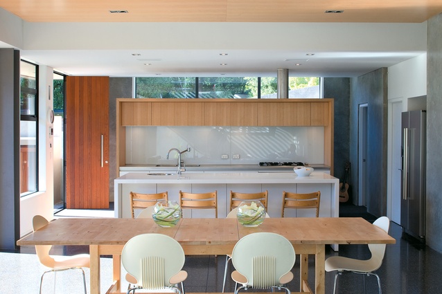 In the kitchen, Marc Barron has used a simple material palette of raw concrete, timber and white plasterboard.  