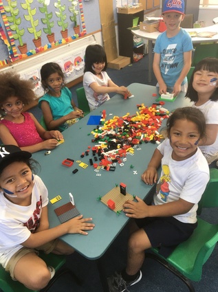 Children from Rosebank Primary School start building with their new Lego set.