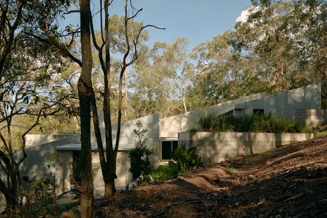 Essentially single-storey, the house appears to climb up the hillside.