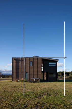 Goal posts frame the eastern elevation of the house from the footy pitch next door. 