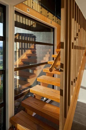 The wooden stairway in the entry hall. 