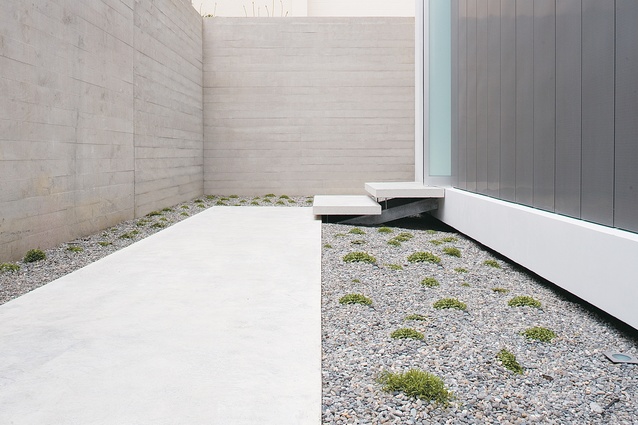 The minimalist entry path and front door of the Parnell house designed by David Ponting and Richard George.
