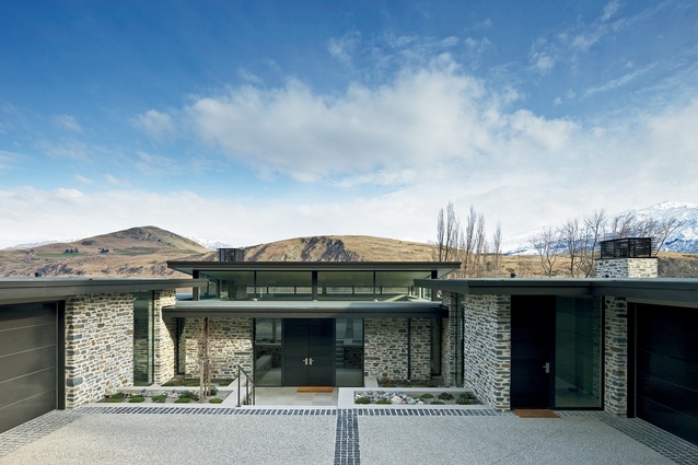Lake Hayes house, Queenstown. Built in 2008. Local stone predominates on this house, grounding it to its site.