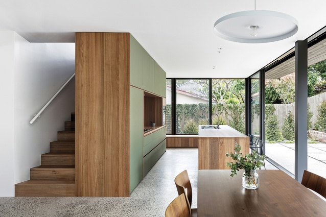 Spotted gum timber, concrete flooring and green linoleum in the kitchen reflect the colours and textures of the landscape.