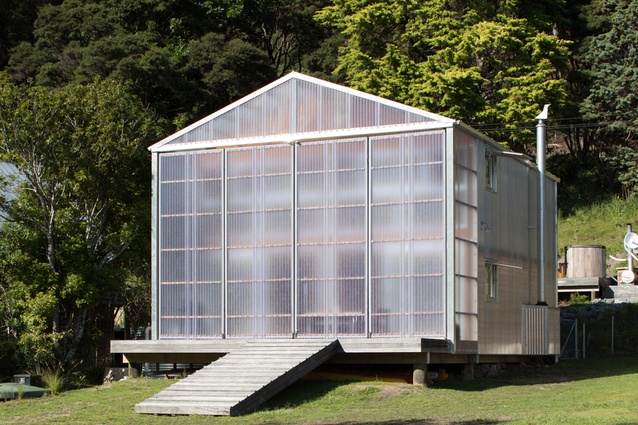 Four-metre-high, translucent polycarbonate-clad doors frame the deck.