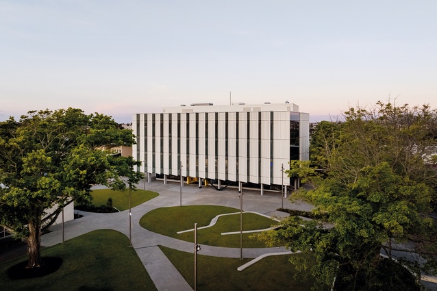 Tukutuku’s public, west-facing elevation is a largely closed, sawtooth wall, hovering above a low, glazed base.