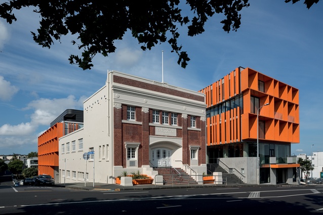 The new building wraps around the existing Orange Coronation Hall, built in 1922. 