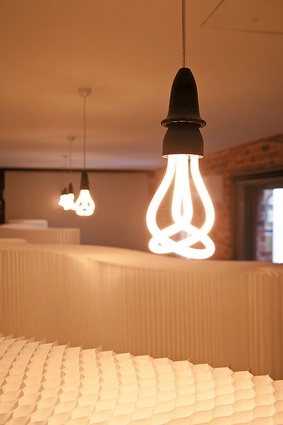 Energy efficient Plumen bulbs hang above Molo Softwalls.