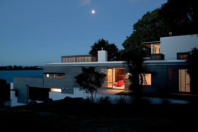 North Shore House, Auckland. This Architectus house steps down a steep hillside next to a reserve.