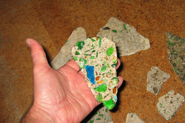 Various segments of glass were embedded in cement biscuit.