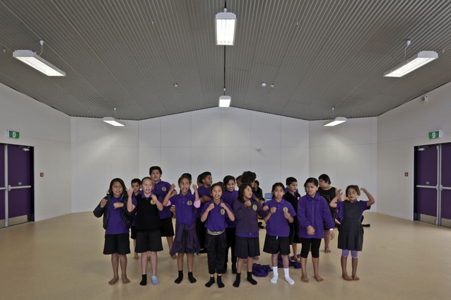 Children congregate in the assembly hall, the 'heart' centre of the building.