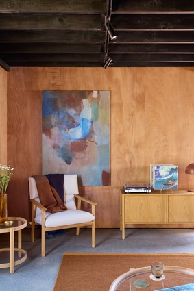 Inside, ground floor walls are clad in plywood.