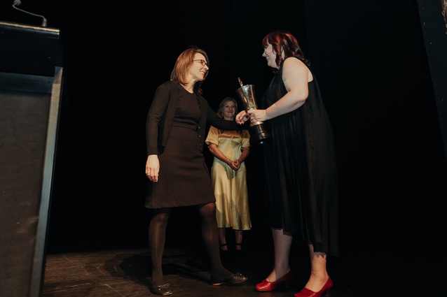 Elizabeth Cox, on right, pictured here receiving the Ath Cup at the 2023 Wellington Architecture Awards.