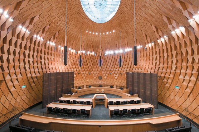 The ceiling of the courtroom within the Supreme Court is topped by a feature glass panel. 
