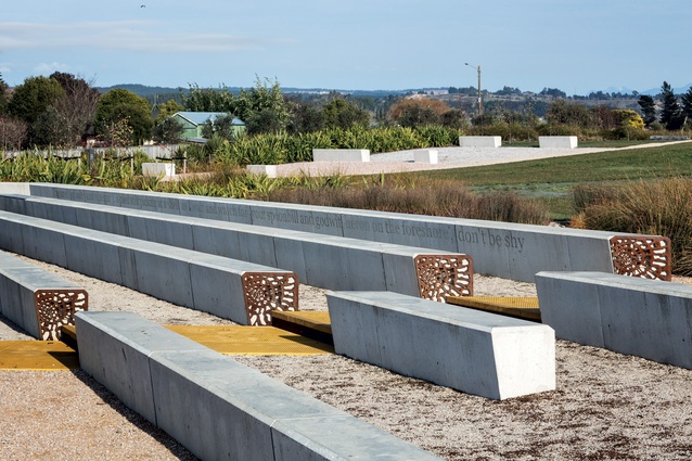 Concrete seating with perforated metal screens at ends.