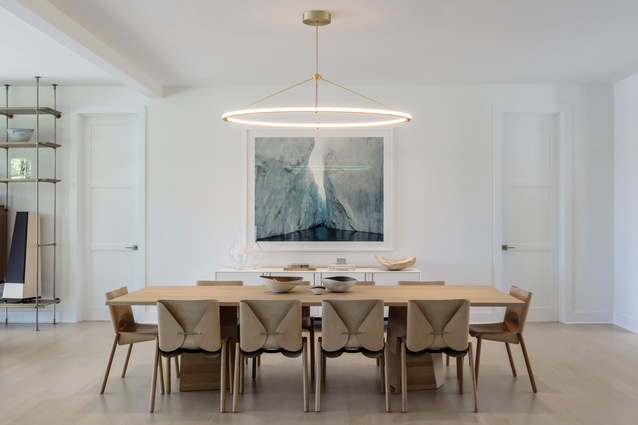 Ipanema lounge chairs from Avenue Road and Cement Ombre Drum side table by Fernando Mastrangelo Studio. The dining room features Bartoli nubuck leather chairs and an artwork by Olaf Otto Becker.