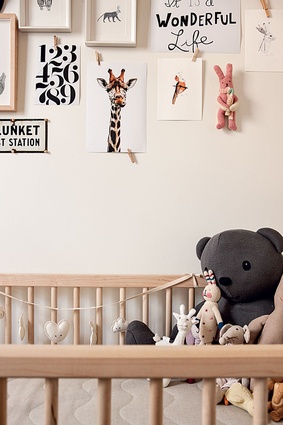 Ivy's bedroom wall is decorated with prints and illustrations of animals.