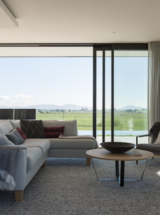 The family room enjoys all-day sun and views of the Hakarimata Ranges.