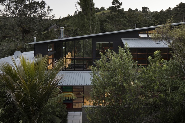 Whare Koa House, Mahurangi West, by SGA Architects. 2017. The house nestles into the New Zealand bush next to an idyllic bay.