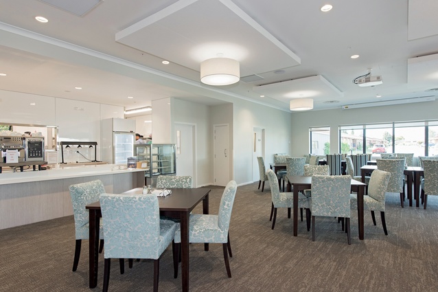 Instead of resembling hospitals, modern retirement homes look to gain a residential feel through, among other things  upholstered chairs and an accessible kitchens.