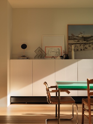 The restrained design provides a backdrop to an eclectic collection of art and collected objects. Artwork (L-R): Lincoln Austin (sculpture); Julian Hocking; Joel Sternfeld.
