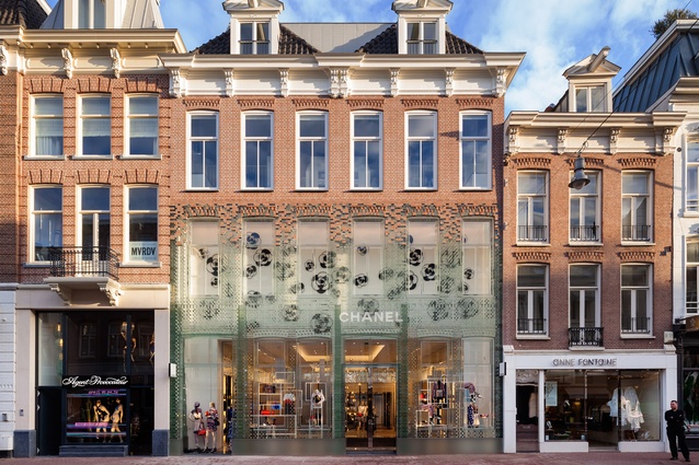 Crystal Houses Amsterdam. To create the illusion of a dissolving wall, the glass elements merge with the original terracotta brickwork towards the upper storeys of the building.