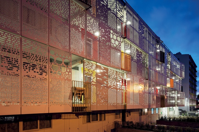 The perforated façade of the Mansfield Block screens residents’ privacy and offers a dramatic patterned light display at night.