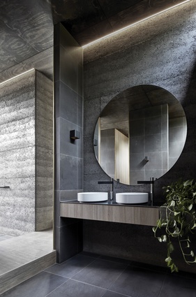 The ensuite is split into two parts, with basins and an indoor shower at the northern side.