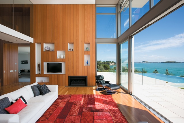 The house, with its cedar-clad interior, looks out to the  Hauraki Gulf. 