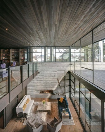 Westmere home. The living room features the largest concrete wall of all. At 11 metres long and 4.5 metres high, it houses the fireplace and runs through to the outside deck.