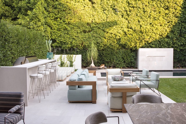 The back garden includes furniture commissioned from The Flemming Group, Andrea Parisio and Wearstler.