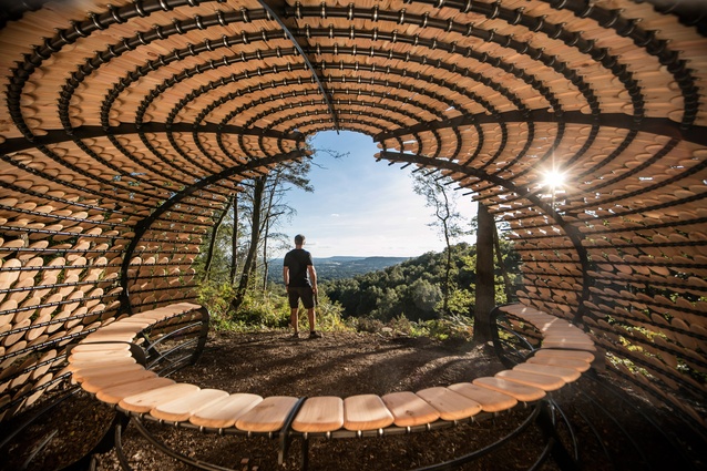 Perspectives installation. Designed as a rest stop for hikers, the cedar wood architecture references organic shapes and is inspired by the beautiful natural surroundings. 