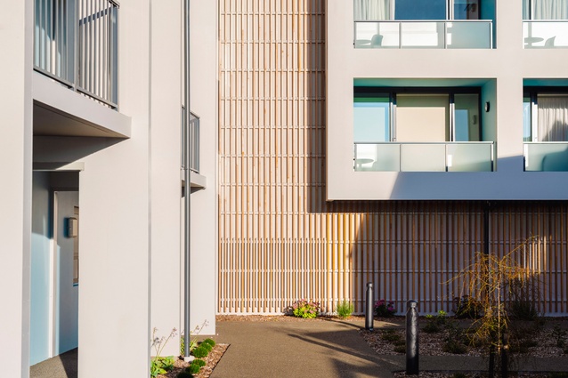 Pre-cast concrete was cost efficient while ensuring the building looked good. The concrete work is foregrounded within the architectural design, serving as the envelope of the building. The design has been embellished with additional features, including cedar fins and colour.