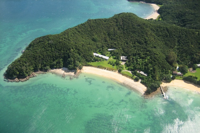From the air, the scattered buildings of Moturua can be seen gathered around shared spaces.