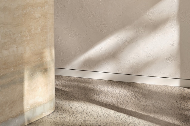 Natural light and thoughtfully placed feature lighting create a dynamic play of light and shadow.