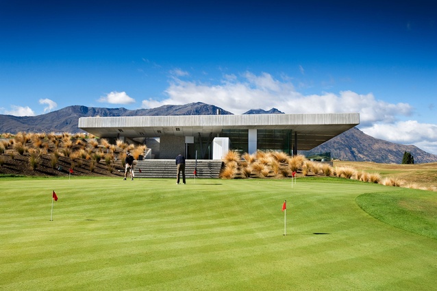 The Hills Golfclub Clubhouse 2008. Resource consent conditions limiting visual impact drive the architectural concept: a clubhouse wedged between tectonic plates – architectural intervention as geological artefact.