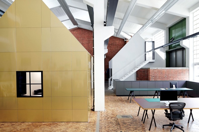 Two separate abodes within a former metal workshop redefine the space for multiple occupation. 