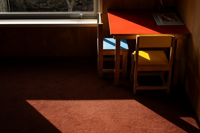 The moody burgundy carpet of the upstairs. 