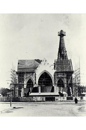 Seen looking west from Worcester Street, the north transept, choir and spire under construction about 1880.