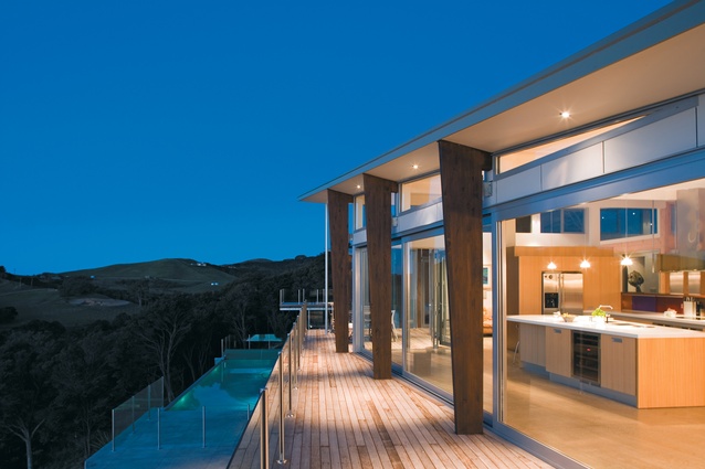 Looking along the upper level deck on the north elevation of the Waiheke house designed by Geoff Richards.